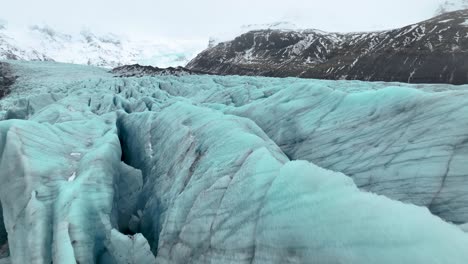 svinafellsjokull glacier and mountain in iceland - aerial drone shot