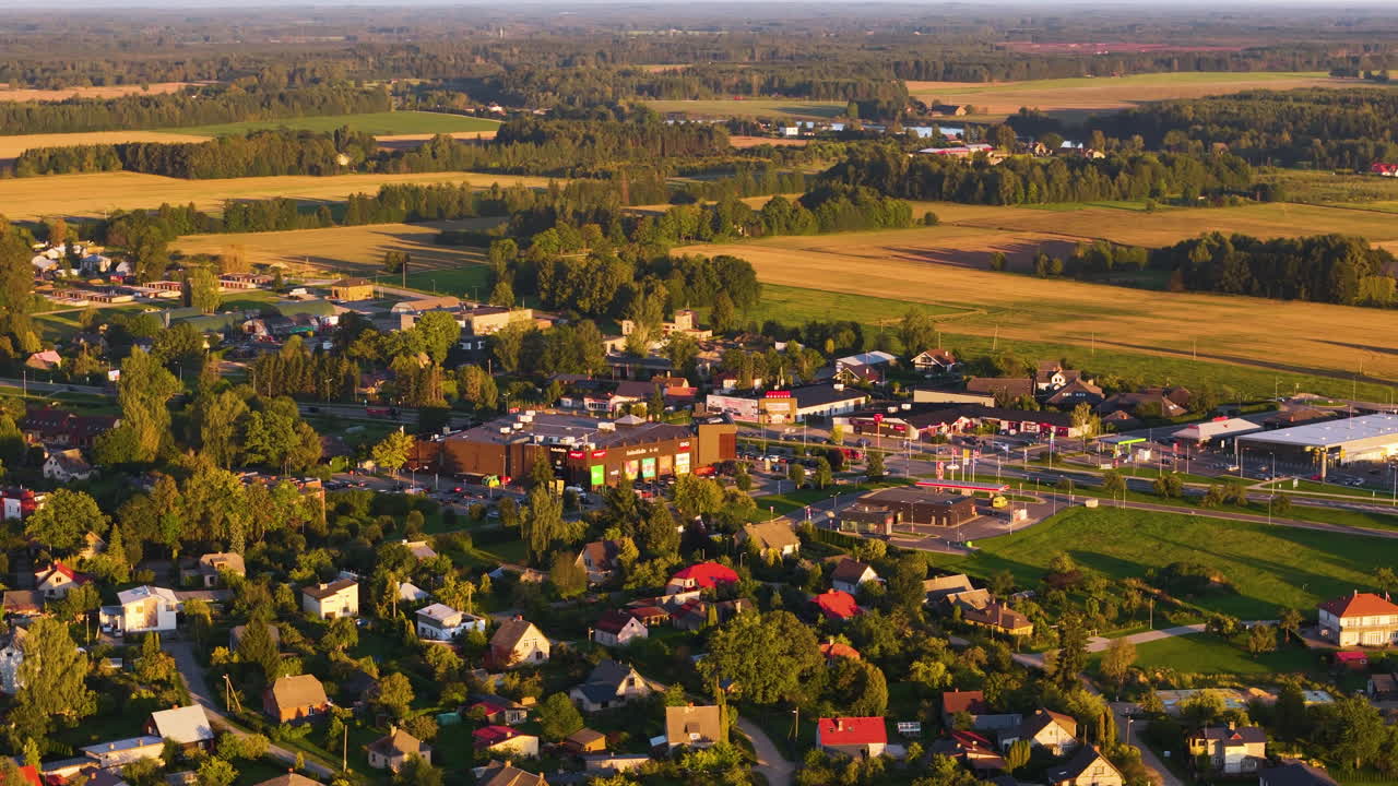 Retail Shopping Center In Sigulda, Latvia. 4K Aerial Rotation Over The Suburban Neighborhood Surrounded By New Commercial Buildings.