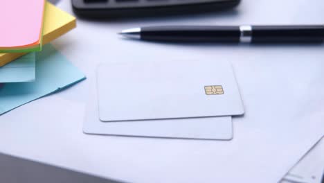 office desk with credit cards and supplies