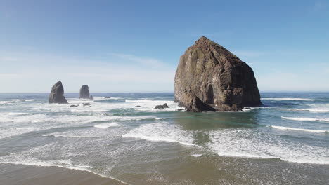 Haystack-Rock-looms-over-the-waves-at-high-tide
