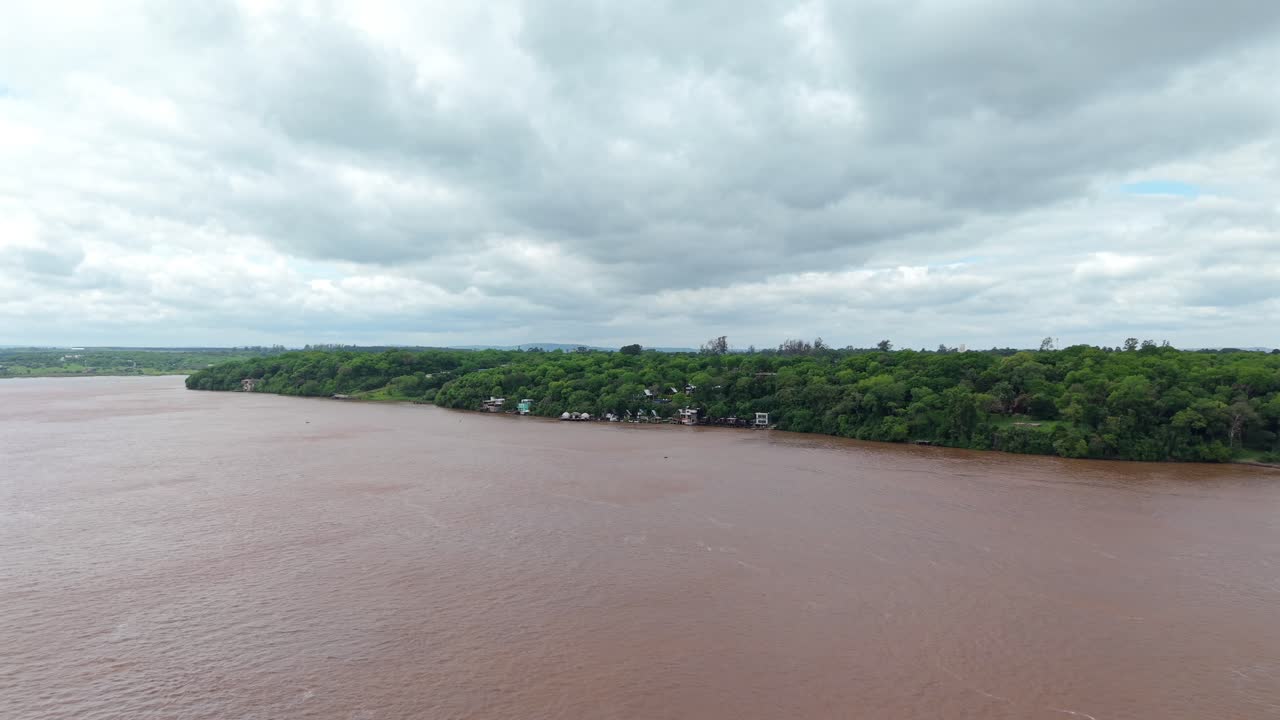 Calm river under cloudy sky in Puerto Lagier, Misiones, Argentina