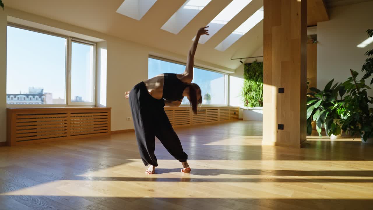 A woman dancing in a modern room