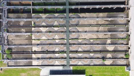 Aerial-top-view-of-circular-ponds-in-wastewater-treatment-plant-and-filtration-of-dirty-sewage-water