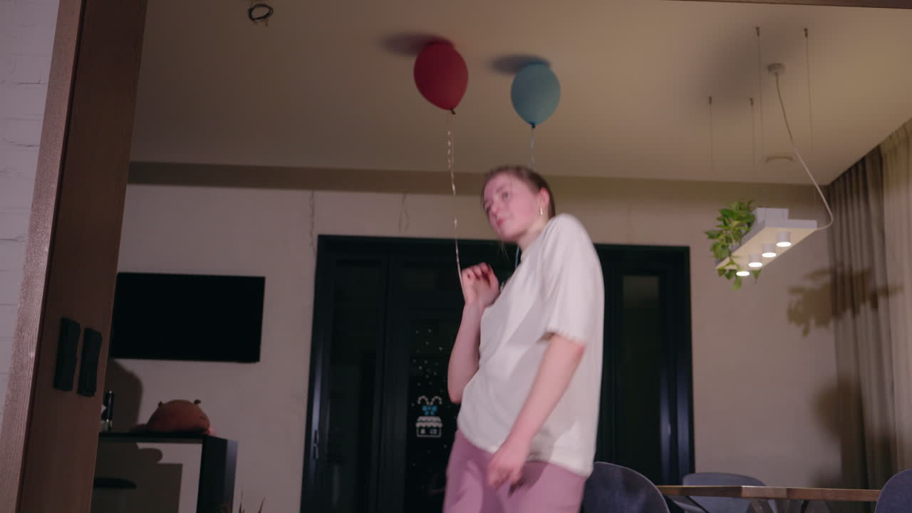 Happy Woman Dancing at Home
