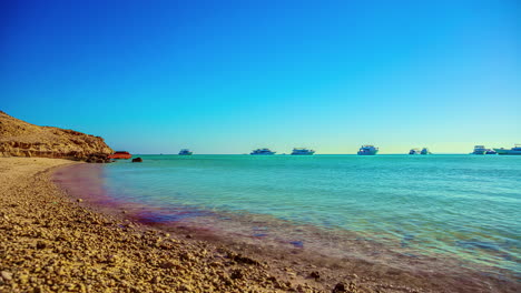 Crystal-clear-water-of-the-Red-Sea-in-Egypt-with-luxury-yachts-anchored-offshore---time-lapse