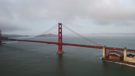 drone shot rising in front of the golden gate bridge, sunrise in san francisco