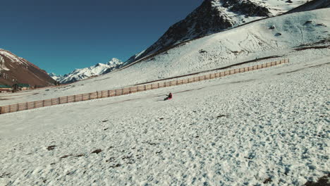 Thrilling-descent-down-snow-covered-Andean-peaks-with-a-julé-patin,-blending-adventure-and-scenic-splendor-in-the-heart-of-the-mountains