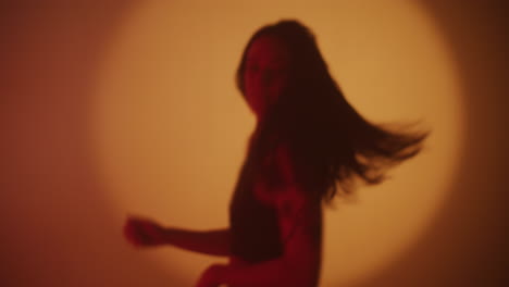 silhouette woman in orange light