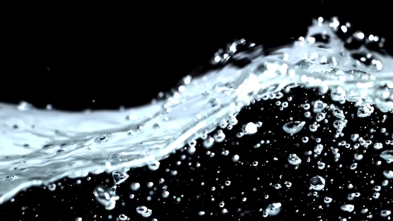 Close-Up of Clear Water Splashing with Bubbles on Black Background