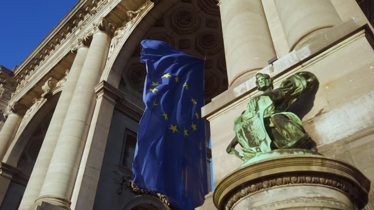 EU flag flapping outside Cinquantenaire arch in Brussels