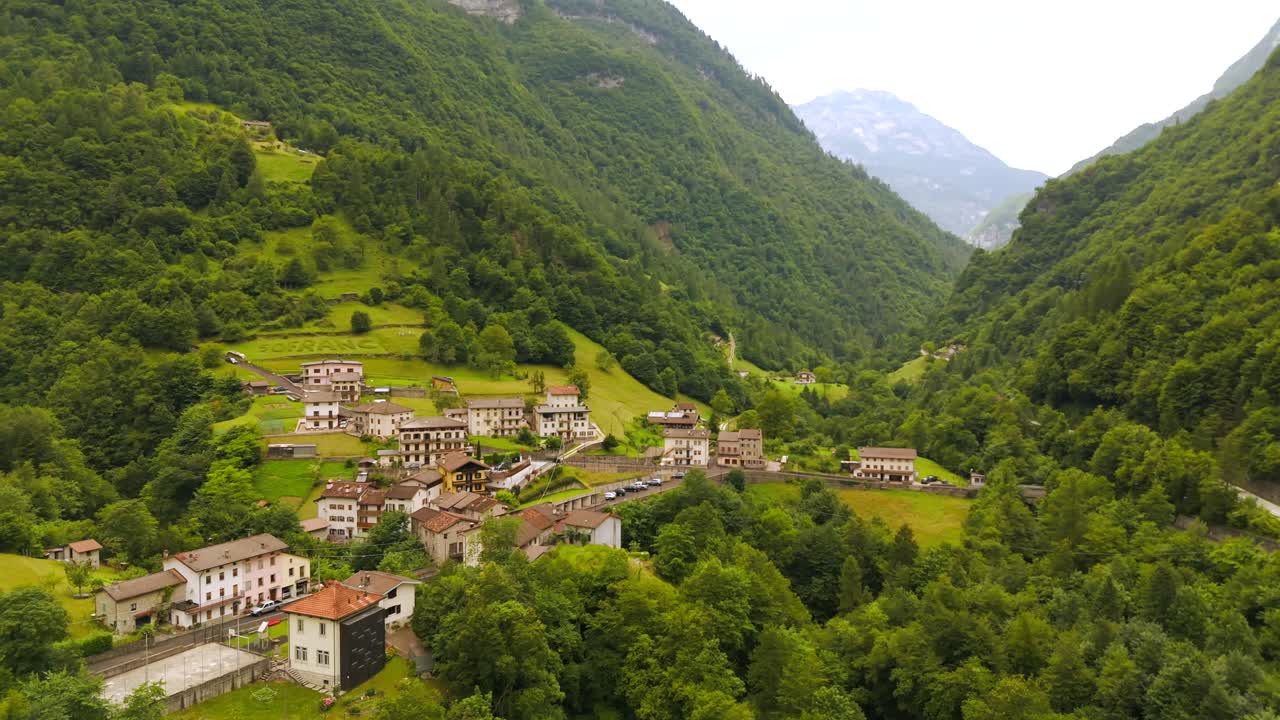 Aerial View of a Mountain Village in a Green Valley