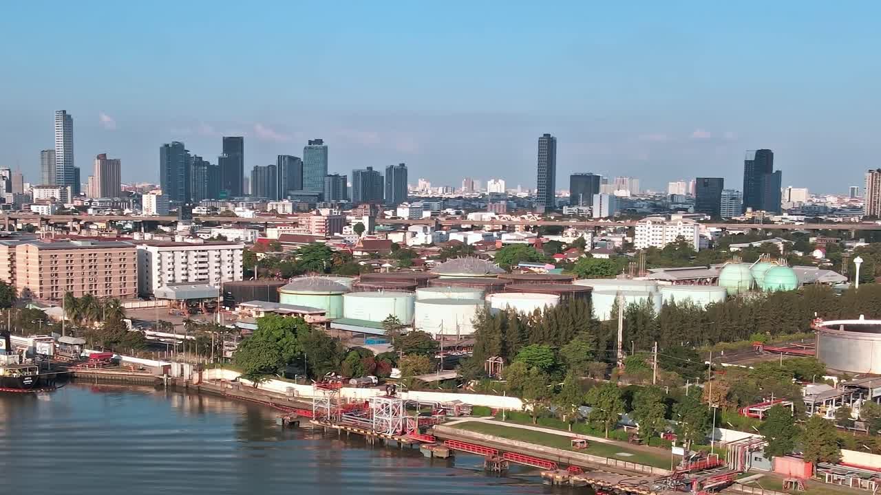 View of the river and cityscape in Bangkok with shipping activity