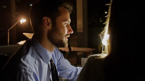 Colleagues-discussing-over-digital-tablet