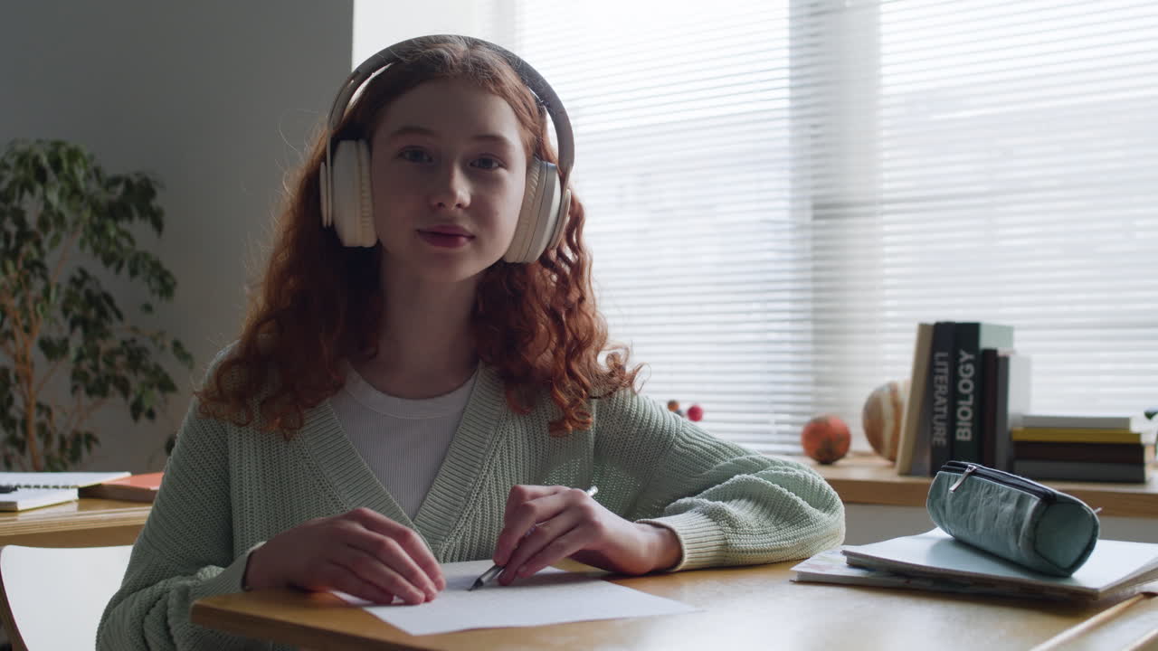 Teenage girl studying in a classroom
