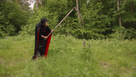 Grim-Reaper-With-Animal-Like-Skull-Head-Holding-A-Scythe