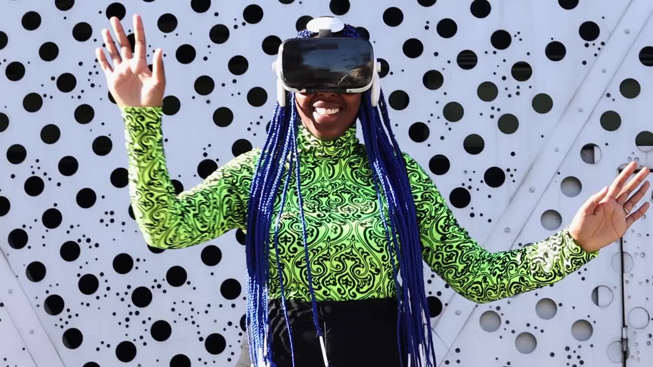 Black woman in VR headset in city