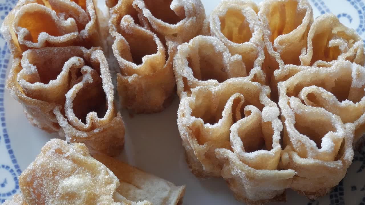 Delicate flor frita, Spanish fried pastry also called flor de Lis