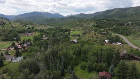 Drone-fly-over-small-settlement-in-White-River-National-Forest,-Colorado