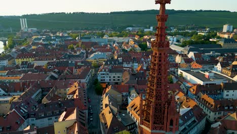 4k aerial drone video of the ornate steeple of st mary's chapel in downtown würzburg, germany