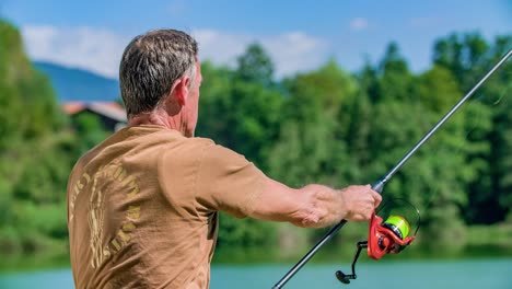 senior fisherman fishing on a lake