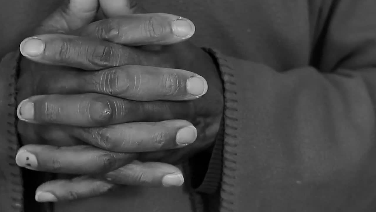 praying to God with hand's together with no cross with people and black background stock video stock footage