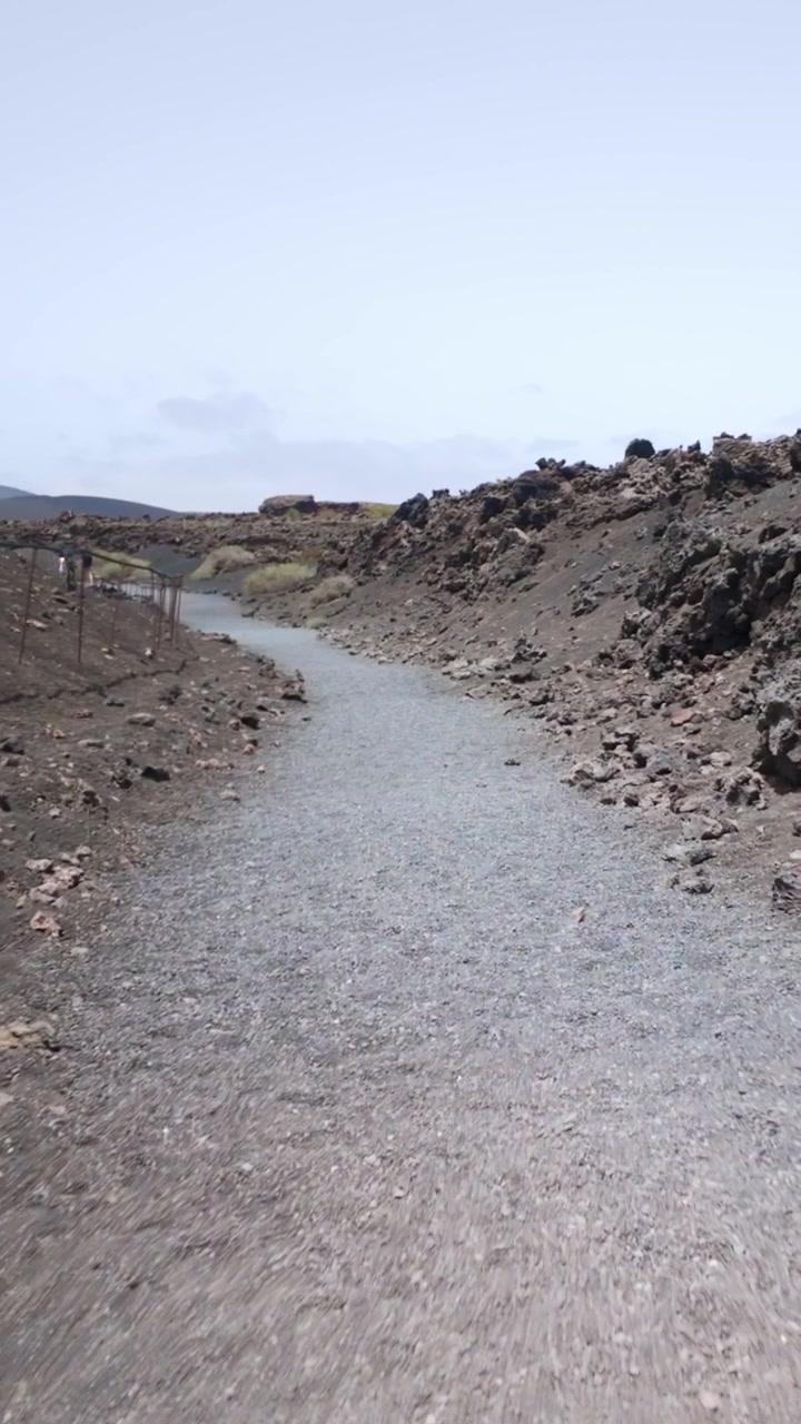 Walking along a volcanic trail in Lanzarote