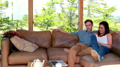 Cute-young-couple-relaxing-on-the-couch