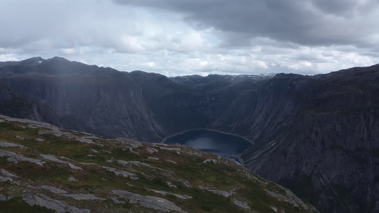 Majestic Norwegian landscape with rocky cliffs and a stunning fjord below, Trolltunga