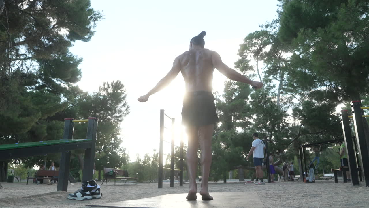 Man Jumping Rope in Park