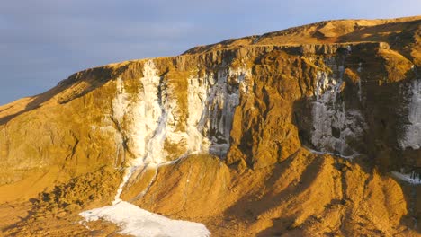 aerial view of frozen waterfall in iceland