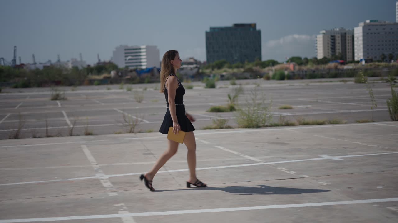 Woman Walking in an Empty Parking Lot