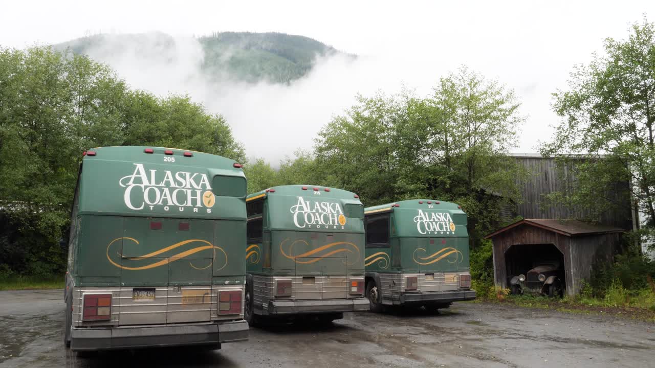 Potlatch Totem Park and Museum in Ketchikan, Alaska. Tour Buses in the parking lot.
