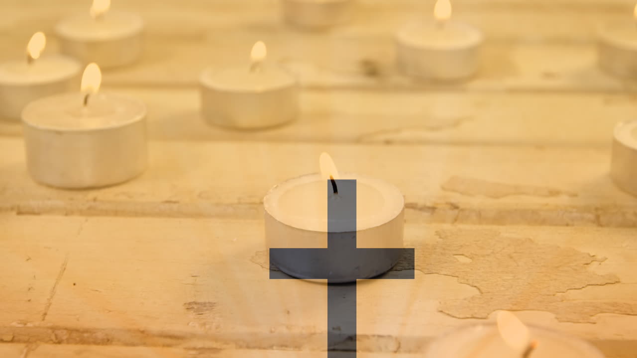 불타는 차등 위에 검은 십자가 모양의 비디오