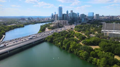 drone flying away from rush hour traffic in austin, texas