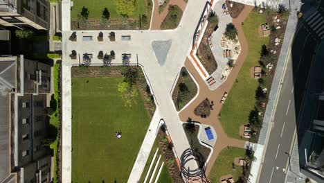 wide overhead aerial video of city quays gardens in belfast, northern ireland, uk on a bright and sunny day. produced in 4k, 60fps and with rec709 color.