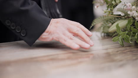 death, funeral and hand on coffin in mourning