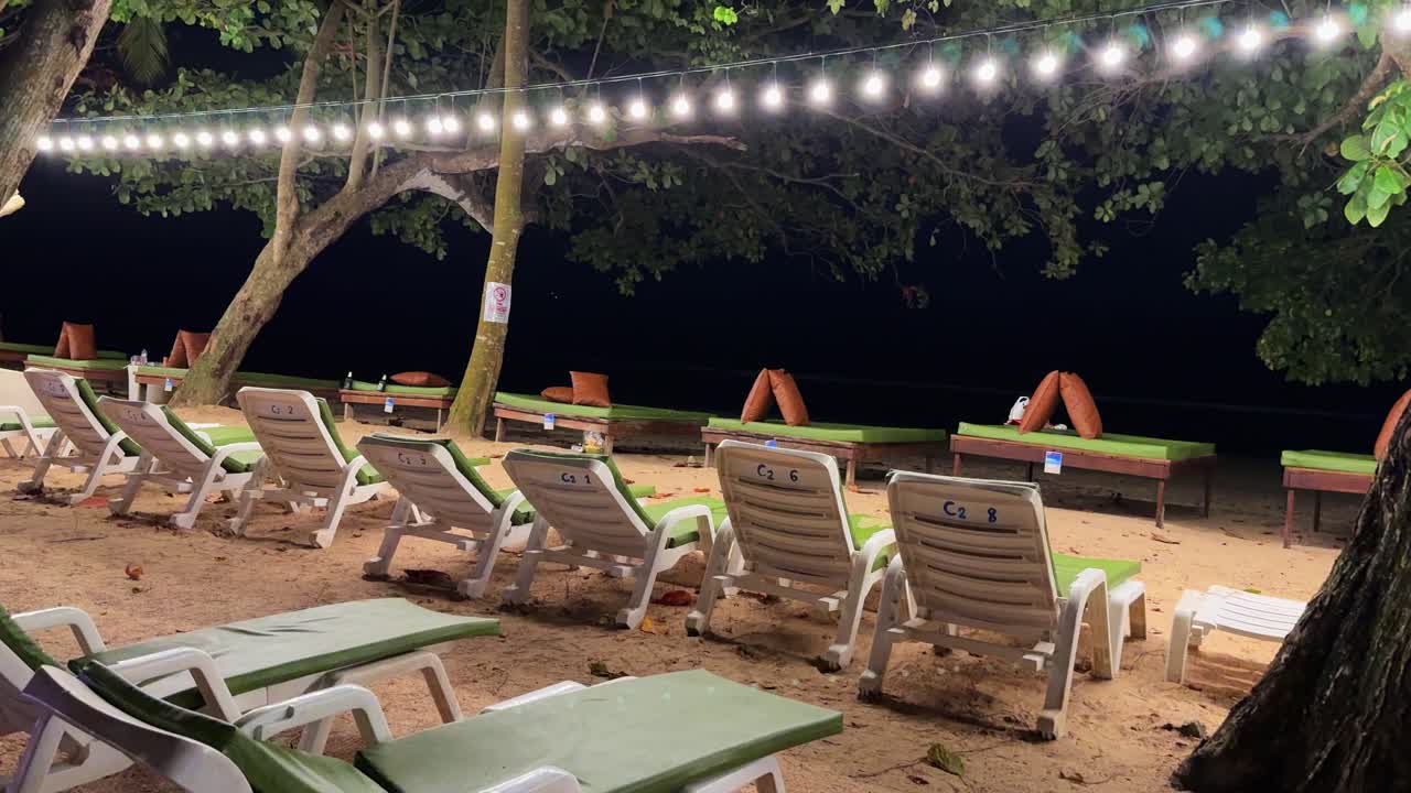 Exotic beach at night, fairy lights romantic atmosphere Krabi Thailand