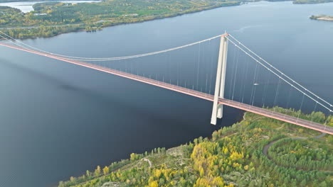 above view of the stunning infrastructure of hogakustenbron bridge with autumnal coastal forests in sweden