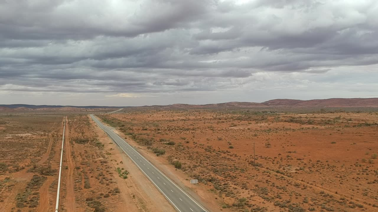 Storm clouds gather of the Sydney Road near Broken Hill