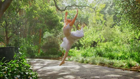 young ballerina dancing in the park 4k