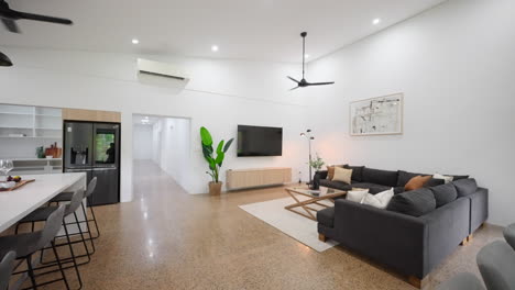 large modern home with polished concrete flooring stylish furniture and stunning pendant lights