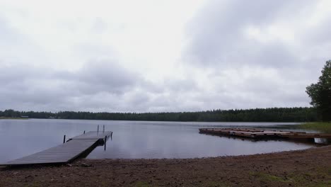 country background time-lapse: clouds drift over peaceful forest lake