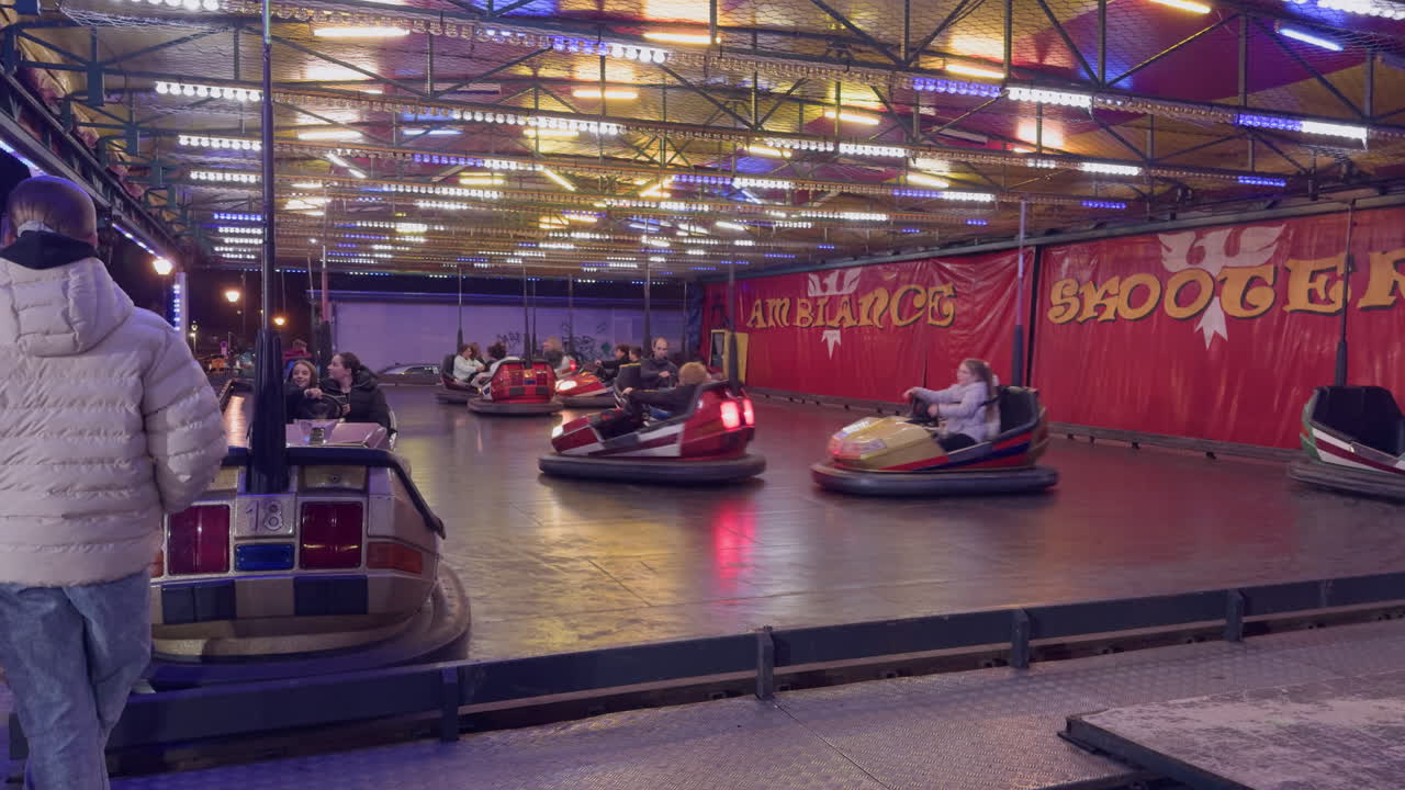 Bumper cars at a lively night funfair in Montrichard Val de Cher France with glowing lights