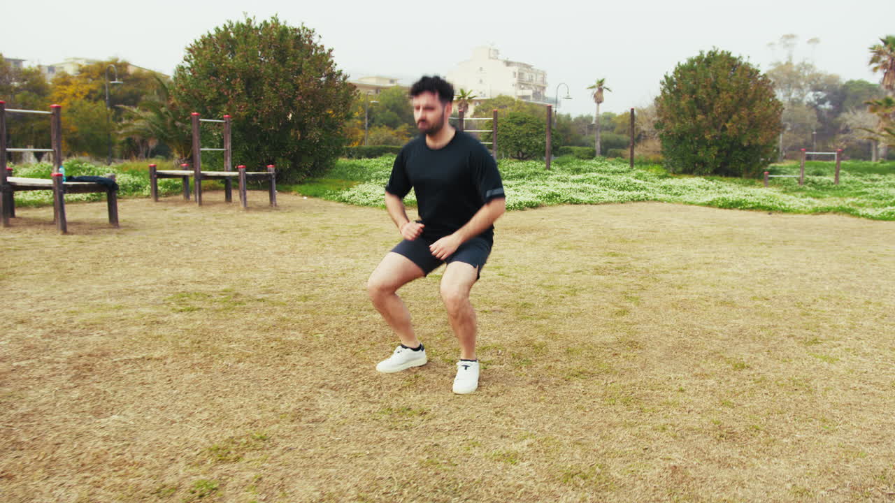 Athlete Trains At The Park Doing Warm Up With Long Jumps