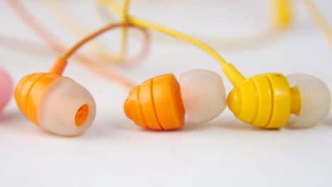 close-up of colorful wired earbuds