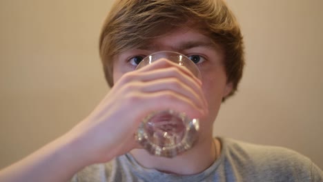 teenager drinking water