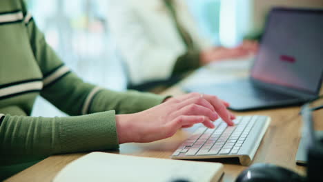 woman working on a laptop in an office