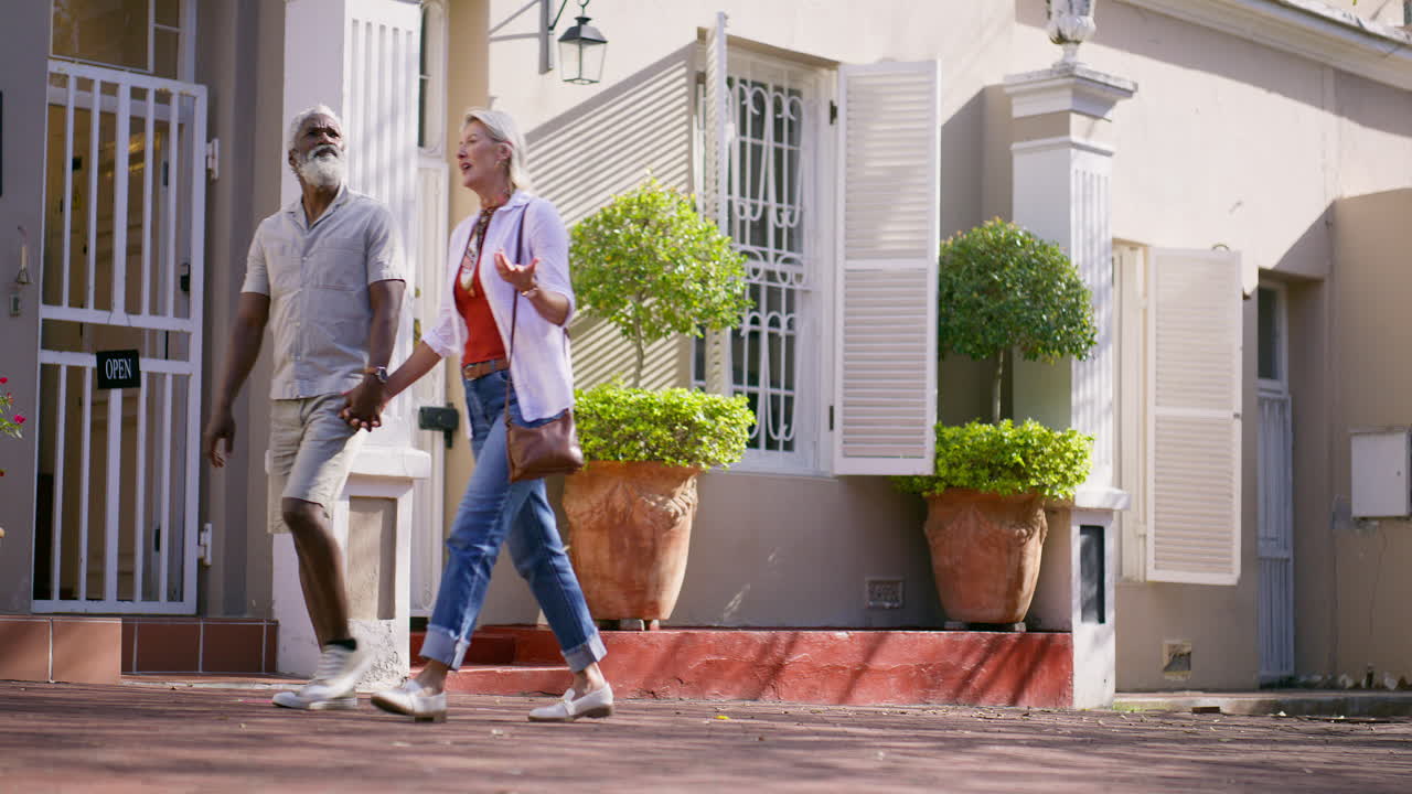 Couple walking on a sunny street