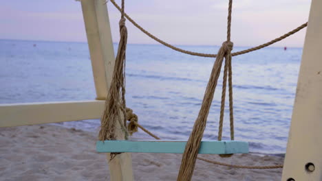 beach swing at sunset