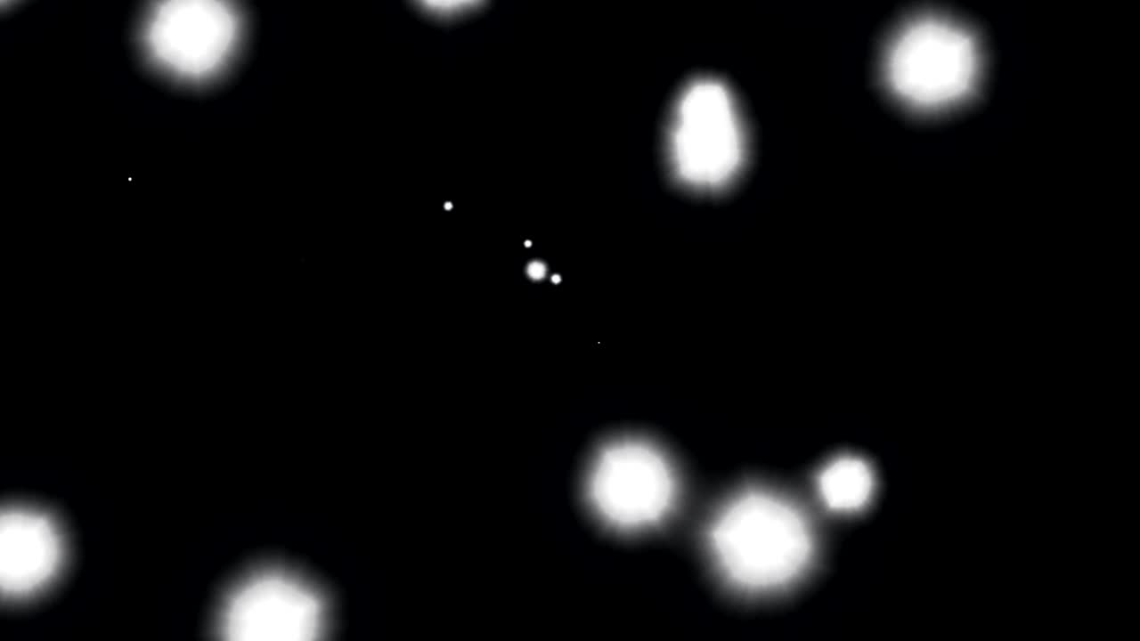 animación de manchas blancas brillantes de luz que se mueven en movimiento hipnótico sobre un fondo negro